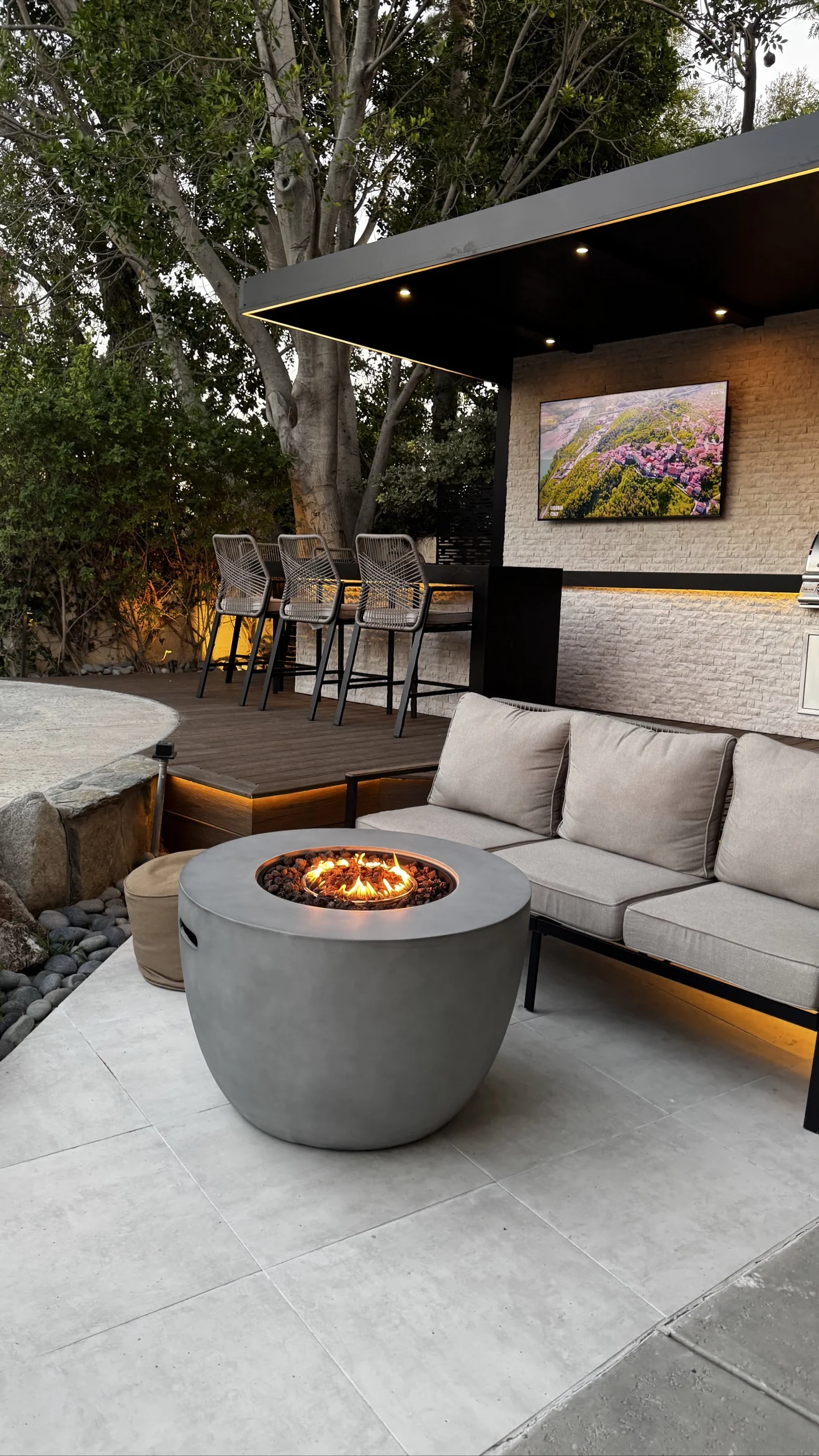 Pavilion lounge with fire pit and bar by Moda Outdoor Living in Porter Ranch, CA — luxury outdoor living design and build