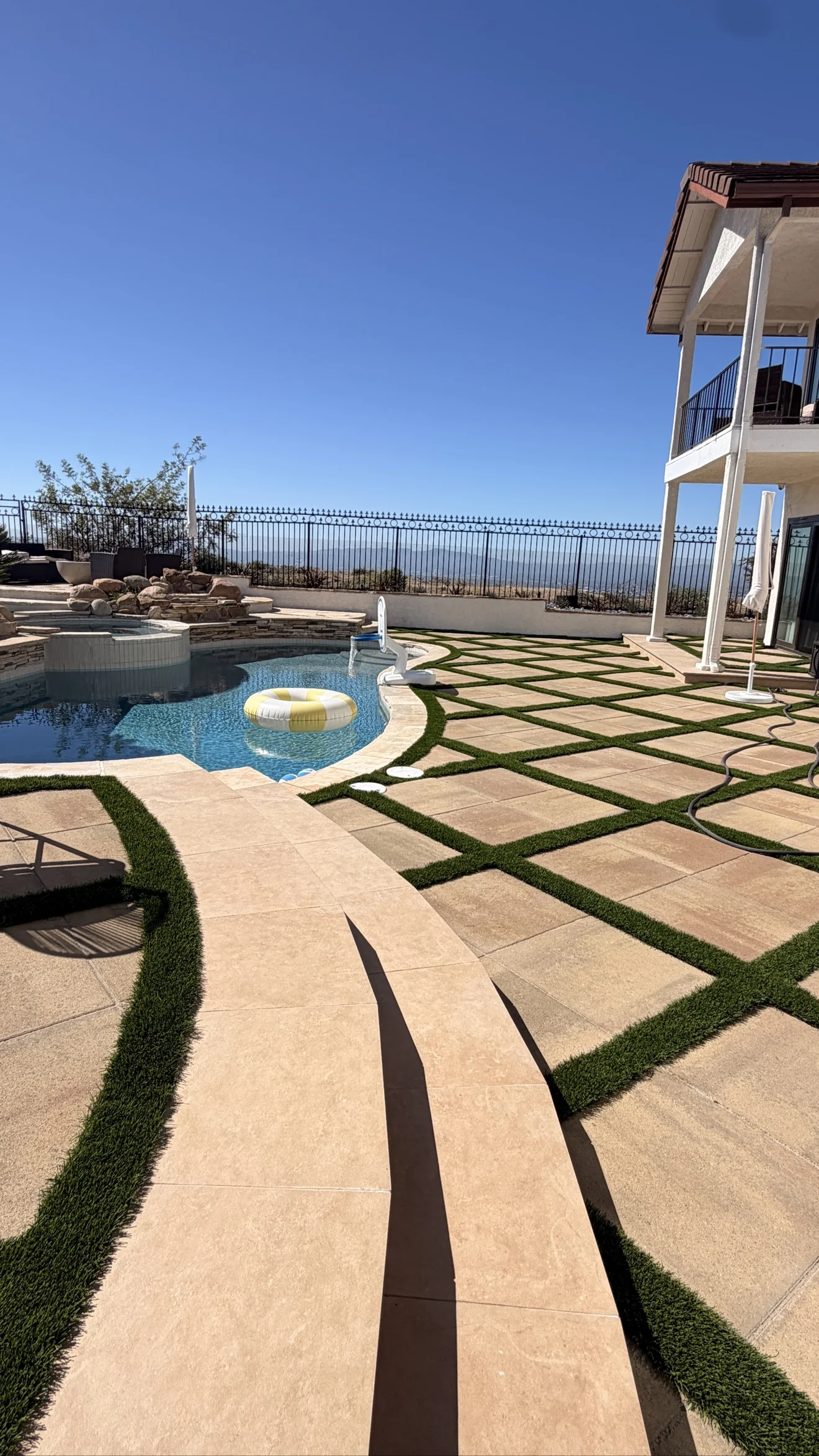 Pool with waterfall, spa and hillside views by Moda Outdoor Living in Porter Ranch, CA — luxury outdoor living design and build