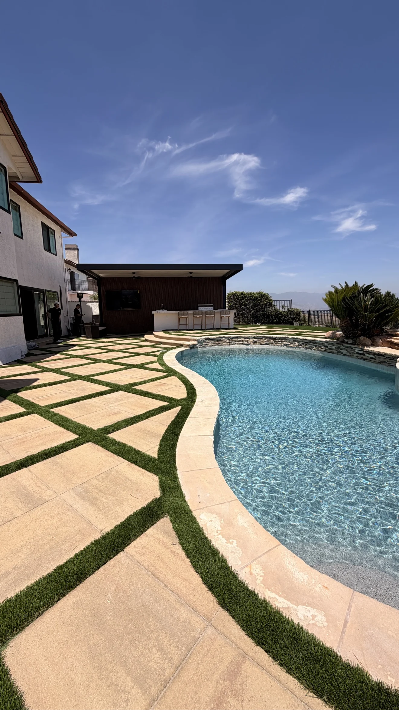 Pool, turf-grid patio and pergola bar built by Moda in Porter Ranch