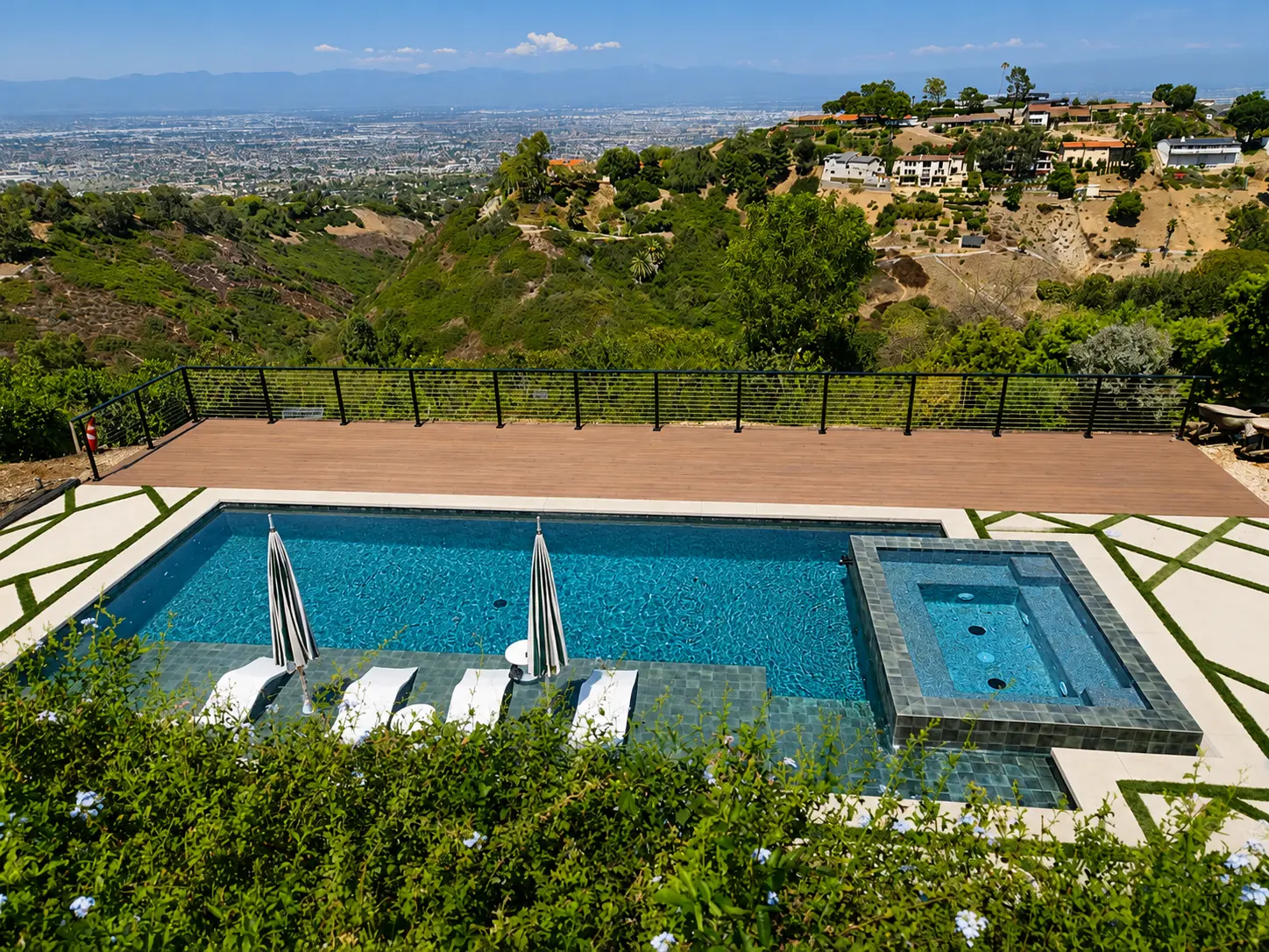 View Pool & Raised Tile Spa with Composite Deck by Moda Outdoor Living in Rolling Hills, CA — luxury outdoor living design and build
