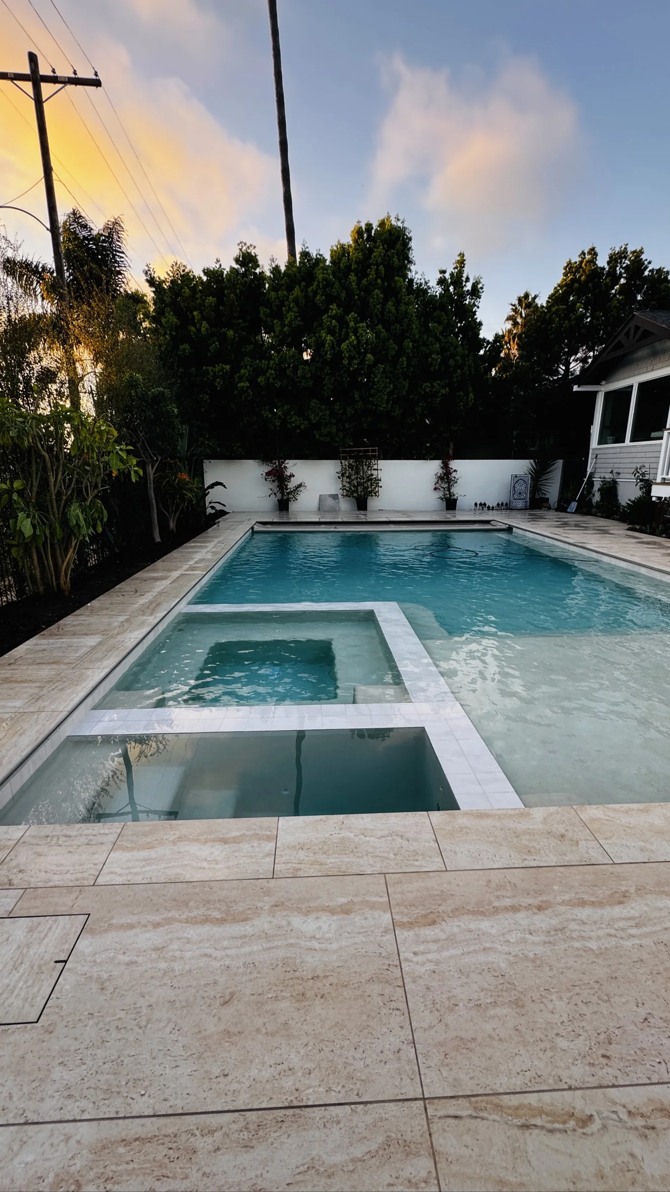 Pool and spa with turf surround by Moda Outdoor Living in Venice, CA — luxury outdoor living design and build