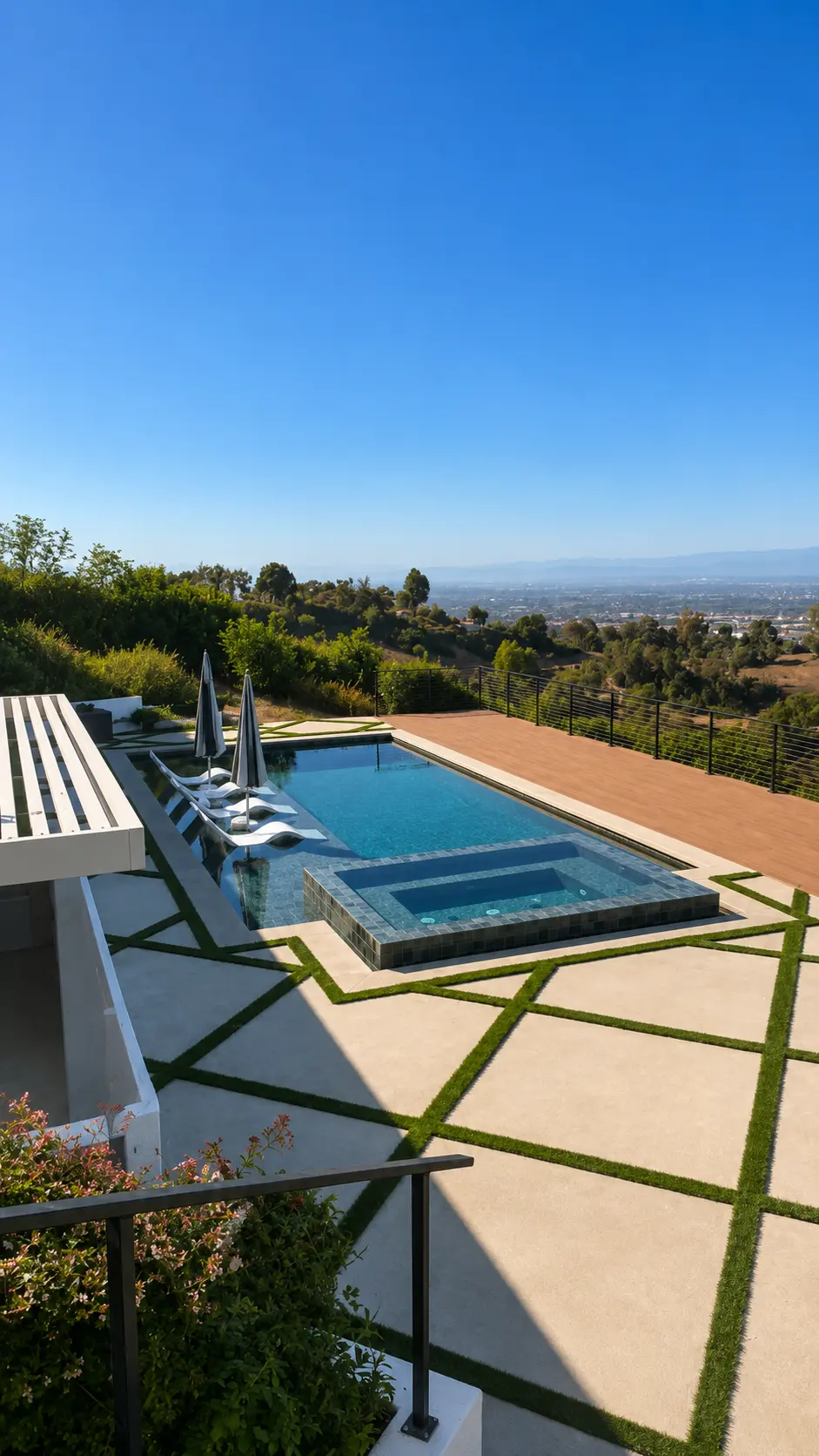Hillside Pool & Spa with Turf-Inlay Paver Deck and City Views by Moda Outdoor Living in Rolling Hills, CA — luxury outdoor living design and build