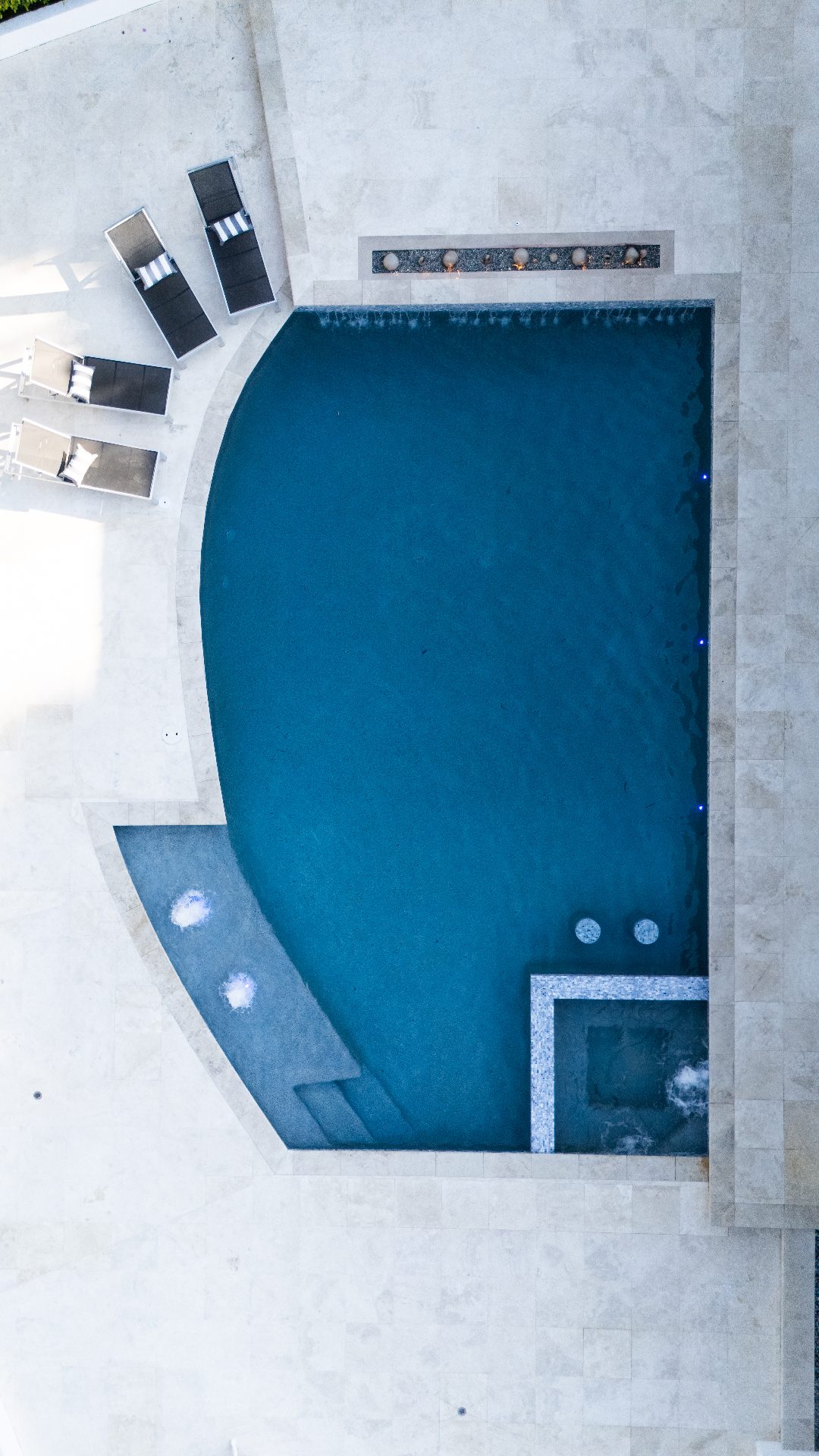 Aerial view of completed backyard remodel at sunset