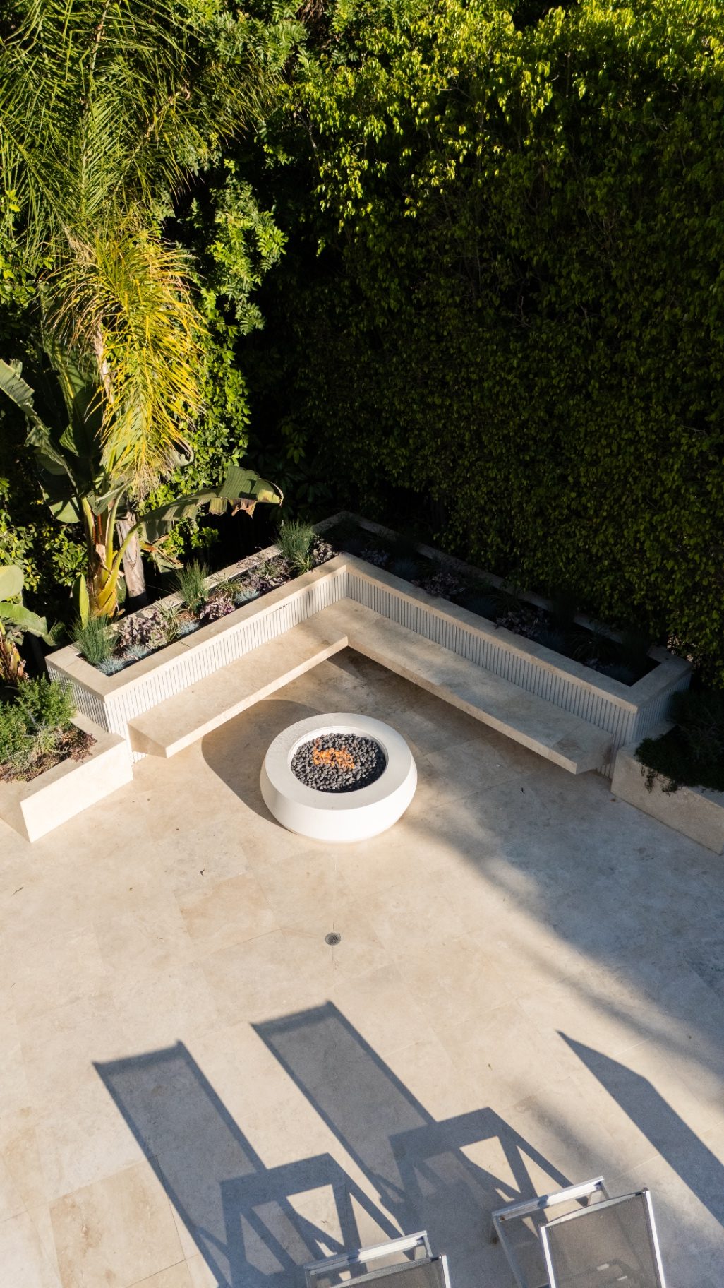 Aerial view of tropical backyard with fire pit seating area