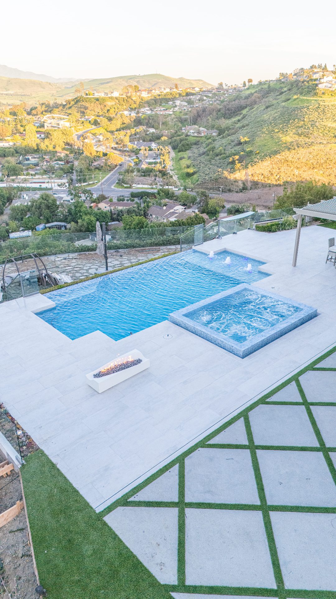 Aerial of pool with turf and pavers