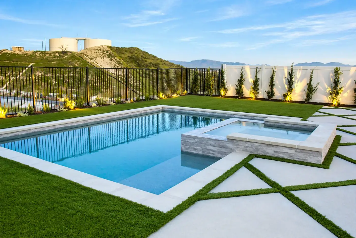 Pool & Raised Spa with Hillside View & Paver Inlay — luxury outdoor living design and build by Moda Outdoor Living