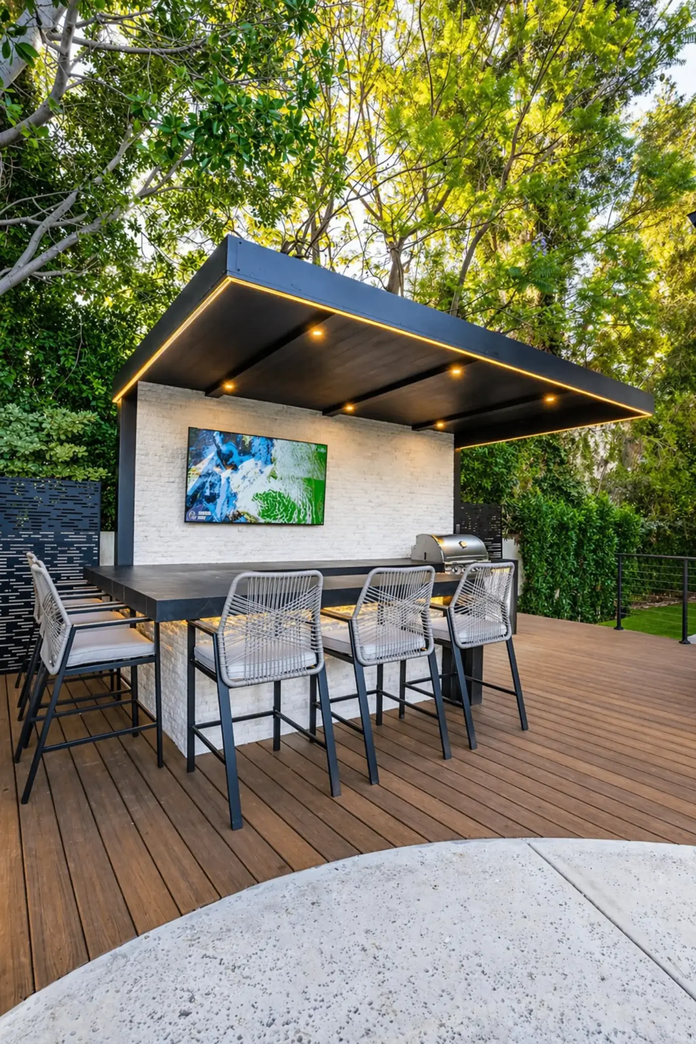 Modern Cabana with Outdoor Kitchen, TV & Deck — luxury outdoor living design and build by Moda Outdoor Living