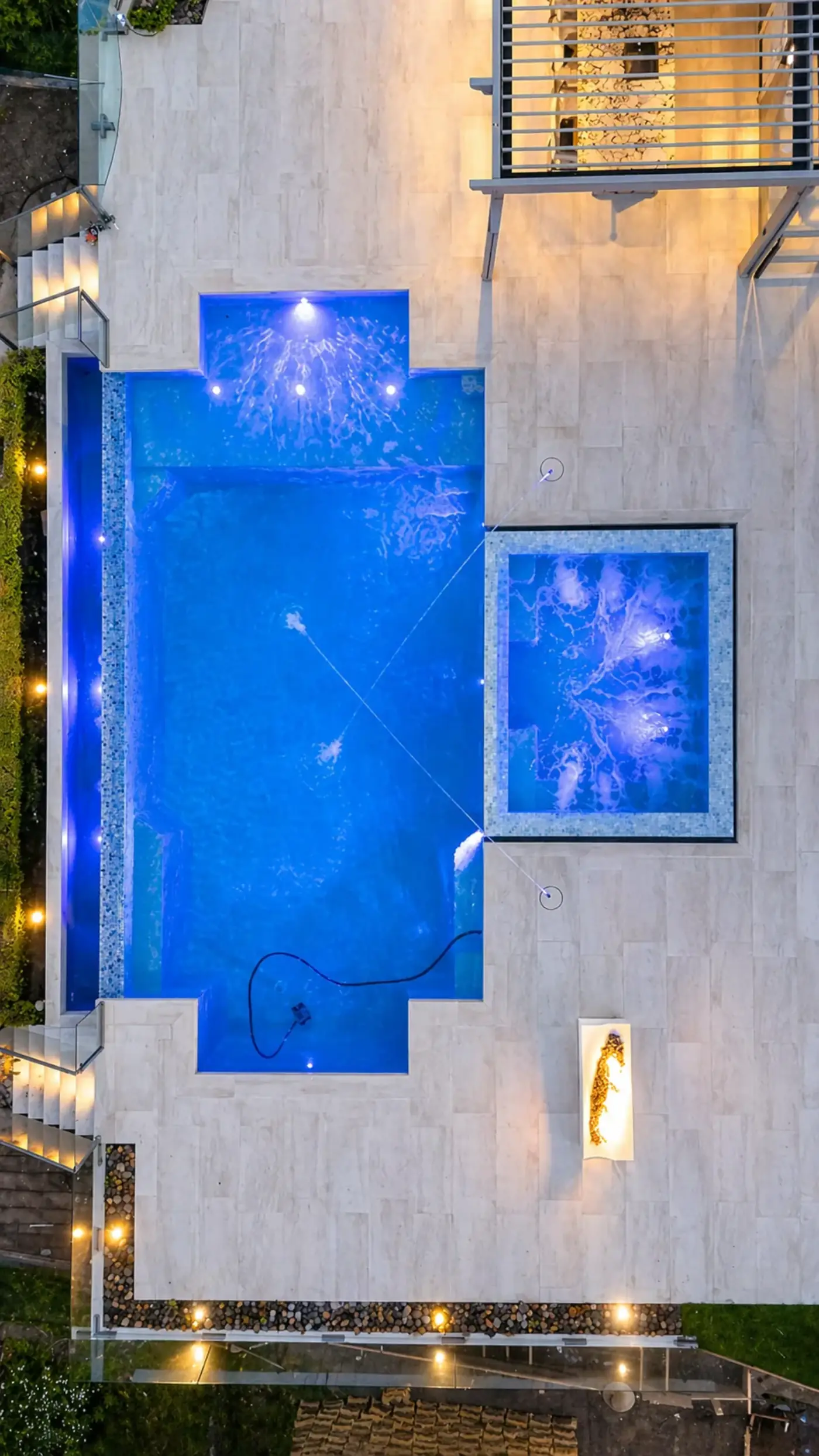Geometric Pool & Spa with LED Lighting & Fire Trough — luxury outdoor living design and build by Moda Outdoor Living