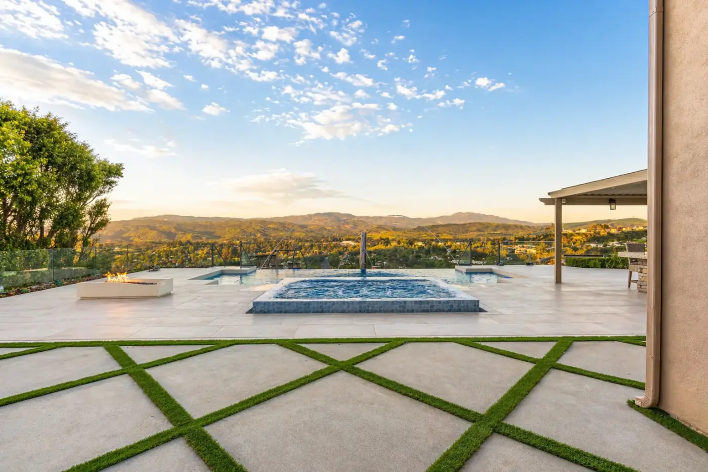 Infinity Pool & Spa with Mountain Views & Fire Feature — luxury outdoor living design and build by Moda Outdoor Living