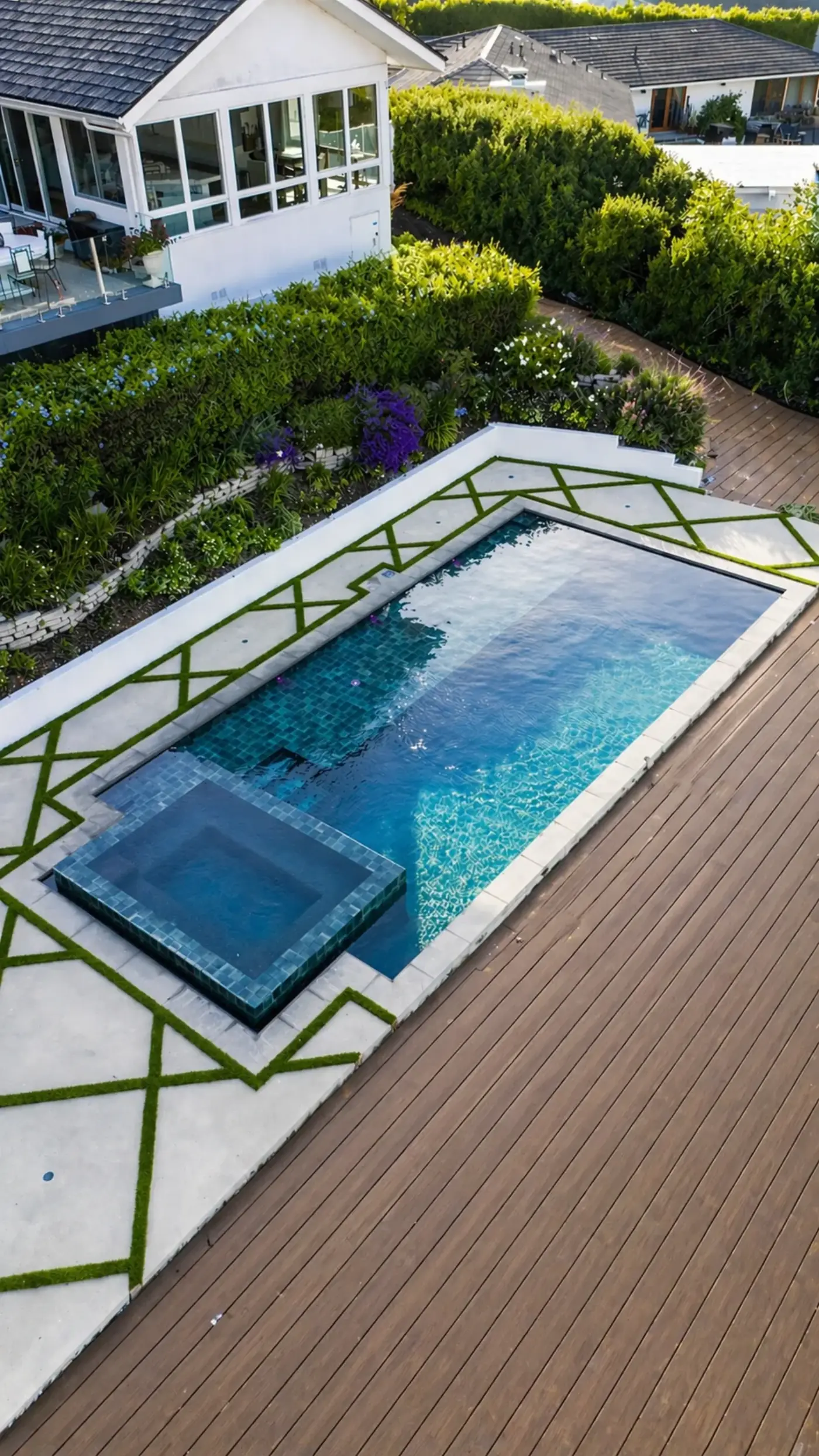 Modern Pool & Spa with Geometric Turf Inlay & Wood Deck — luxury outdoor living design and build by Moda Outdoor Living