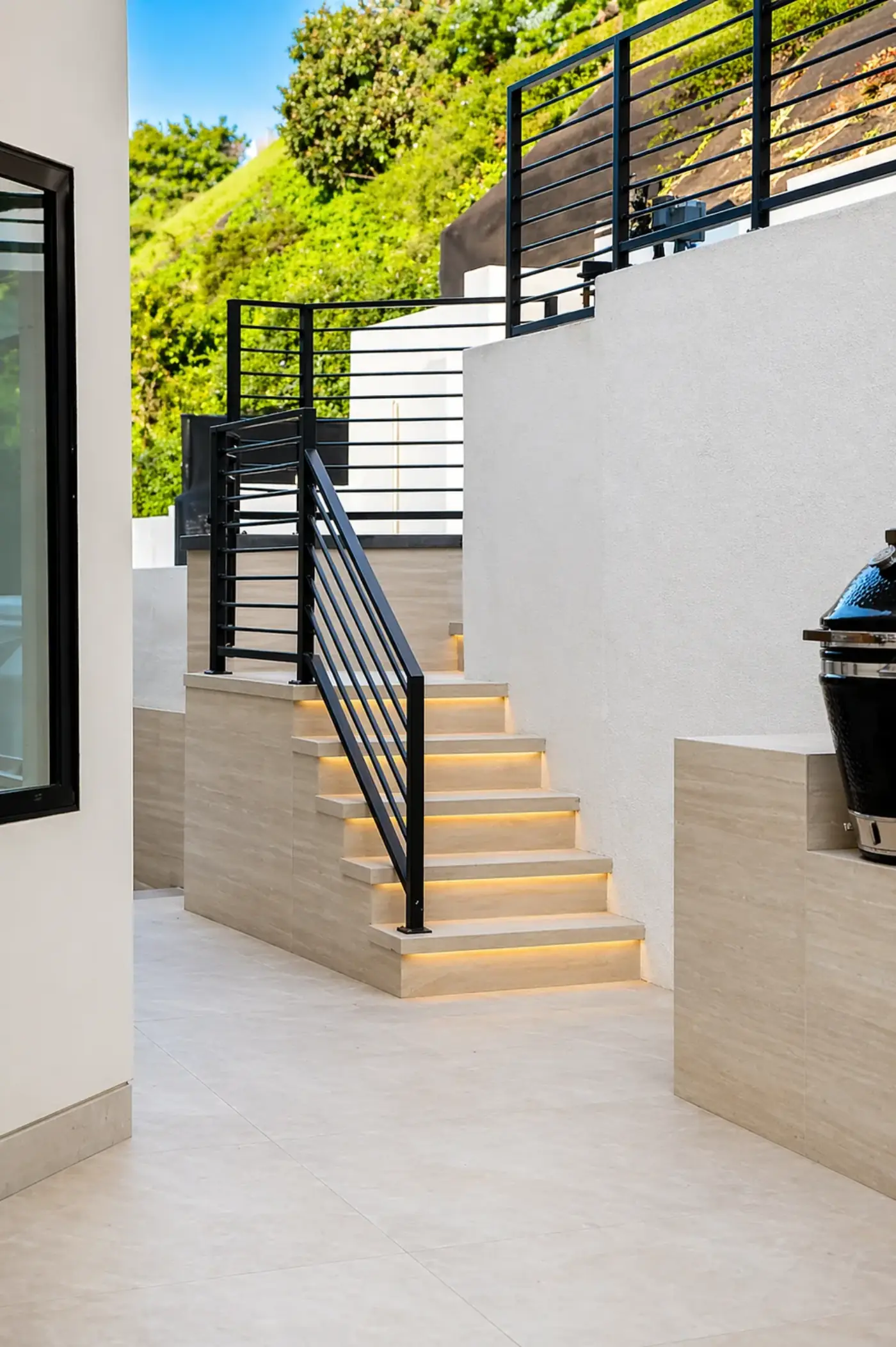 Floating Stair Lighting with Modern Black Railings — luxury outdoor living design and build by Moda Outdoor Living