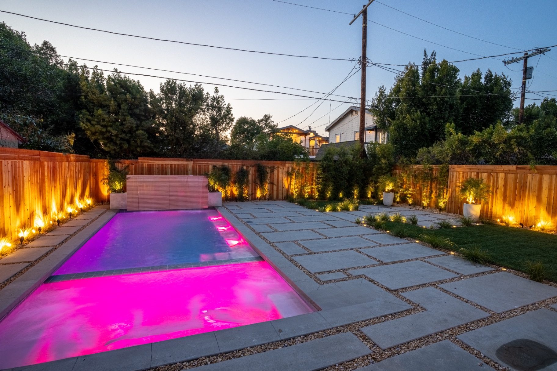 Pool with LED lighting and smart automation at twilight