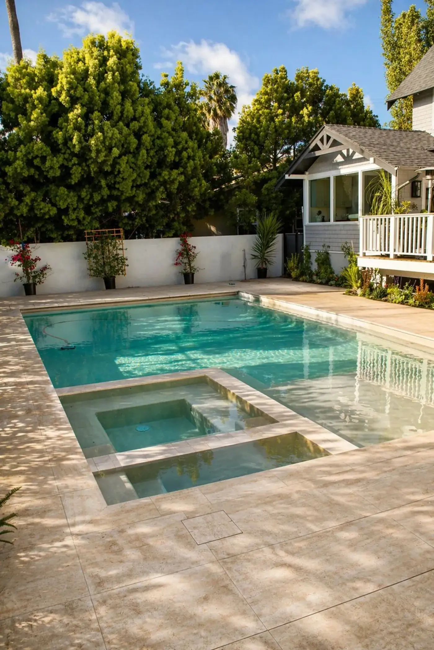 Travertine Patio with Pool & Spa by Moda Outdoor Living in Venice, CA — luxury outdoor living design and build