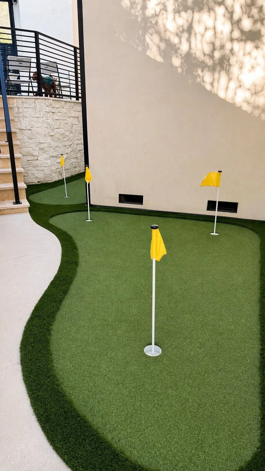 Turf Backyard with Putting Green by Moda Outdoor Living in Baldwin Hills, CA — luxury outdoor living design and build