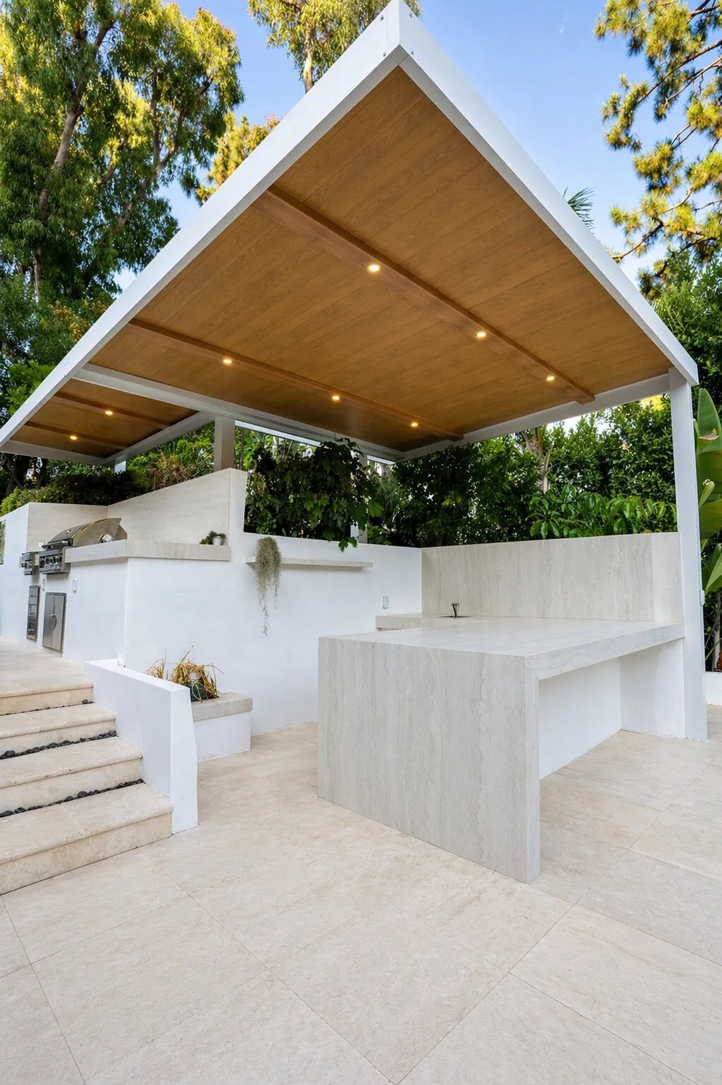 Pergola-Covered Outdoor Kitchen by Moda Outdoor Living in Beverly Hills, CA — luxury outdoor living design and build