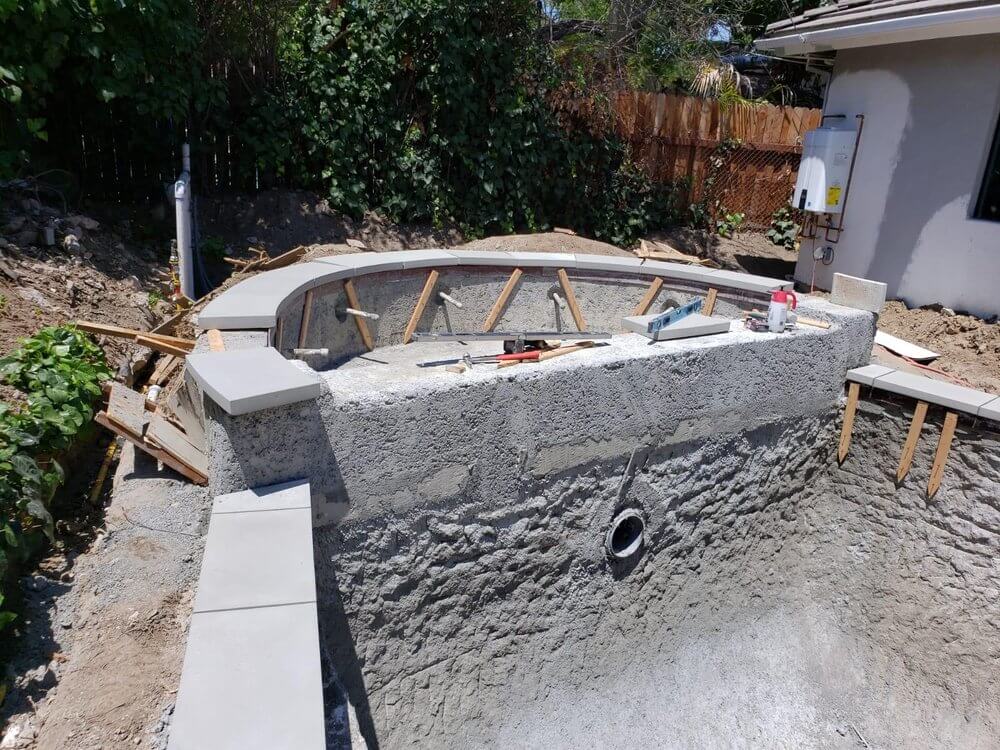 Fresh concrete driveway installation by Moda
