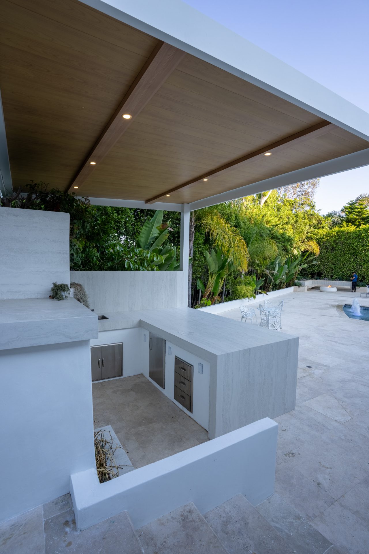 White outdoor kitchen with clean material finishes