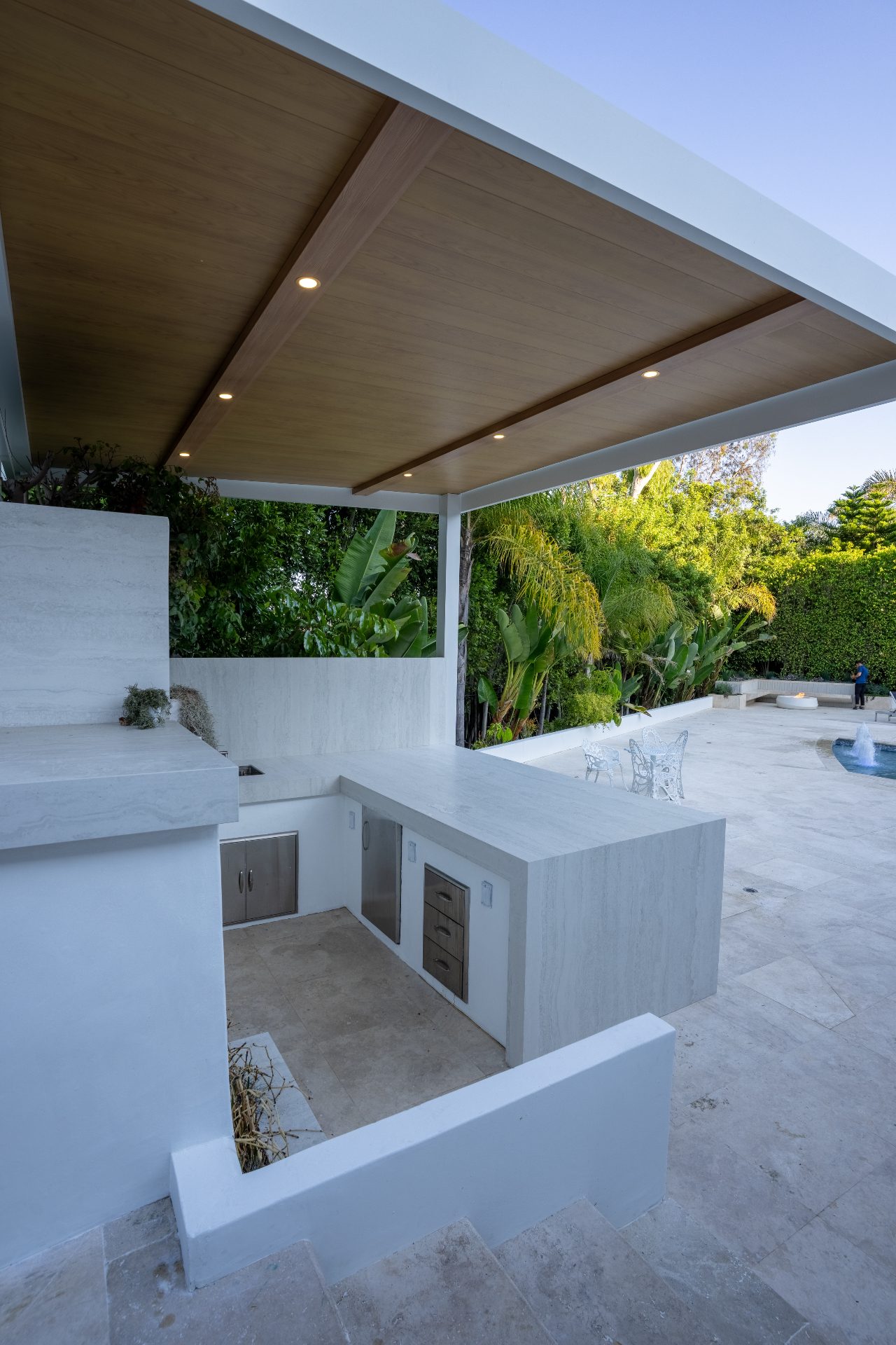 Outdoor kitchen with wood pergola