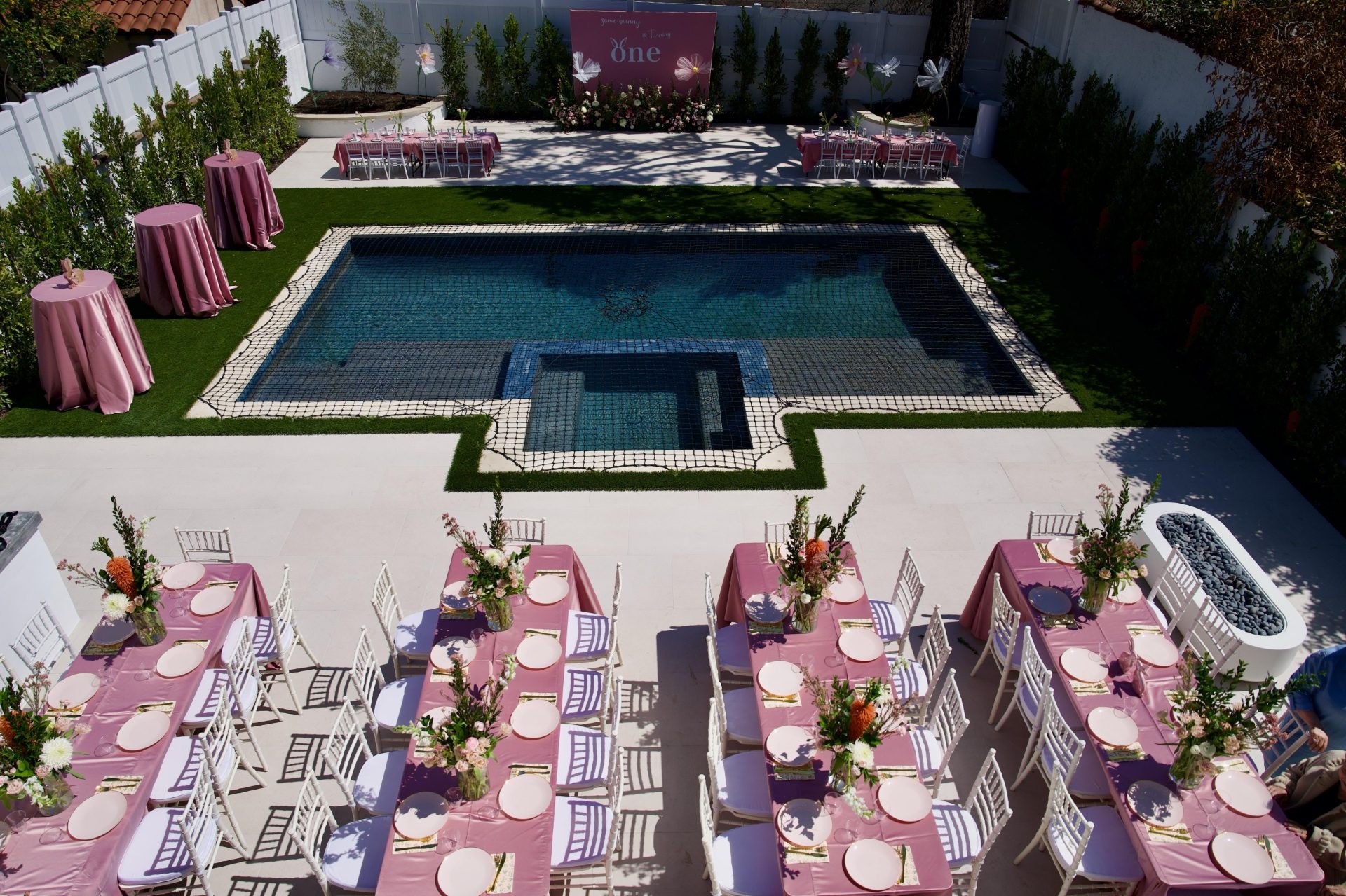 Compact pool on small lot aerial view with party setup