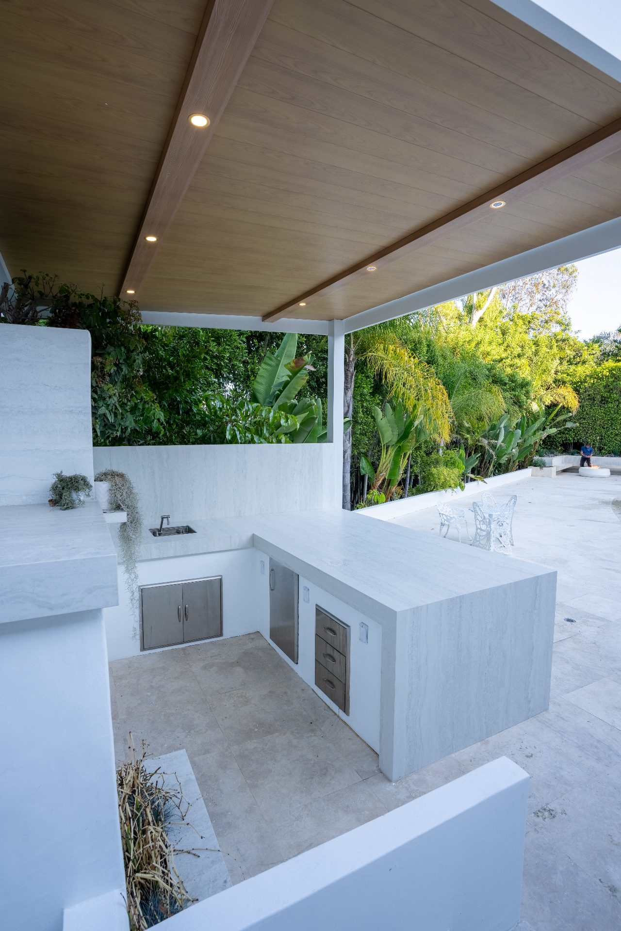 Pergola and pool from a daytime angle showing the covered outdoor living area