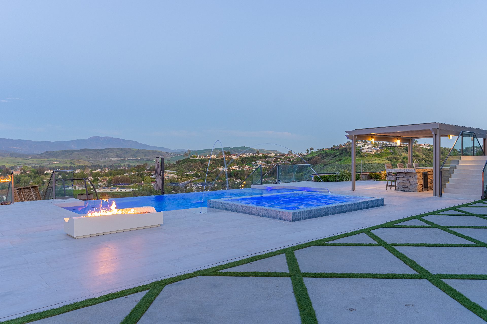 Pool with fire pit and pergola in daylight
