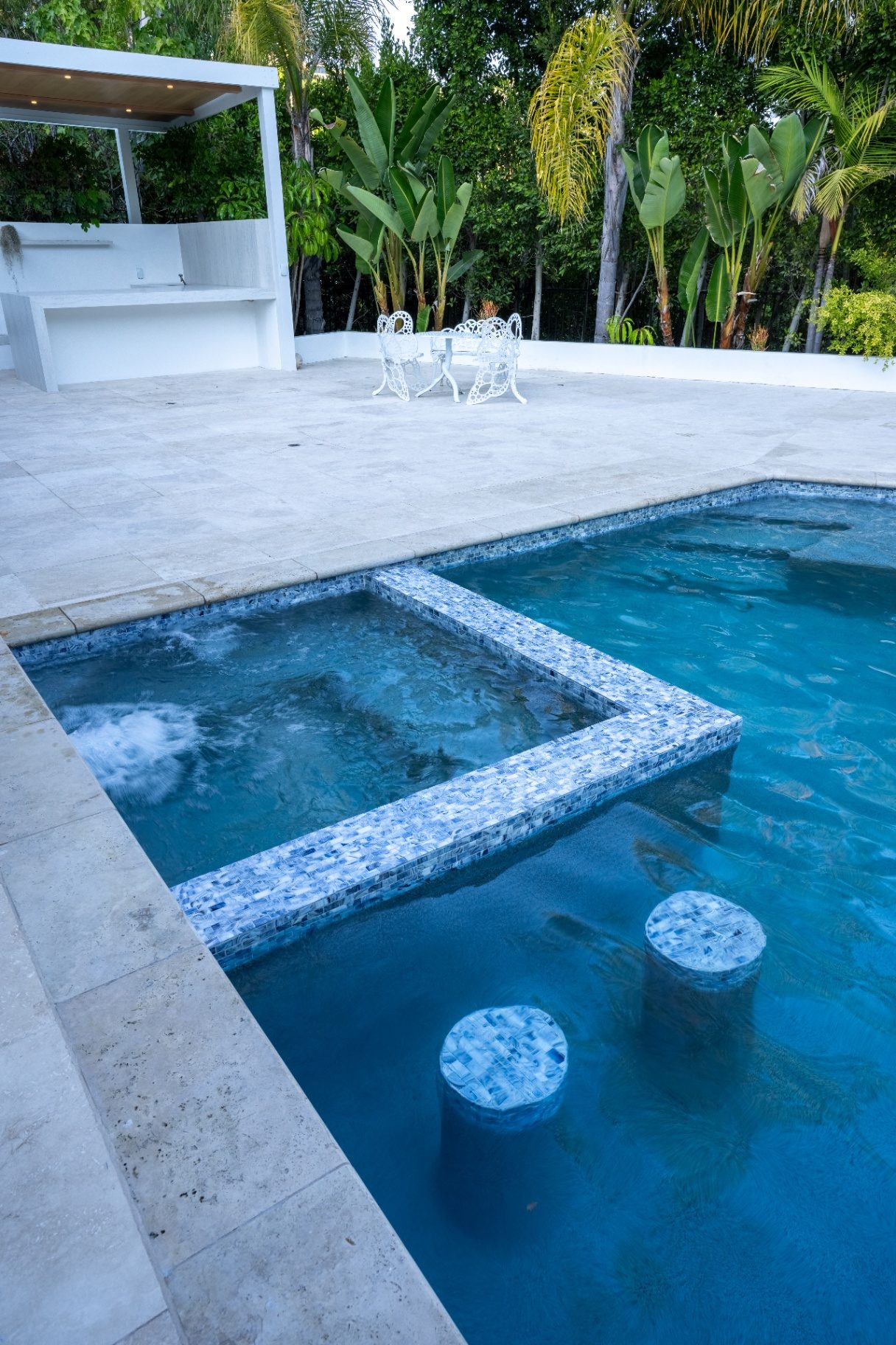 Pool with LED glow at twilight showing completed project