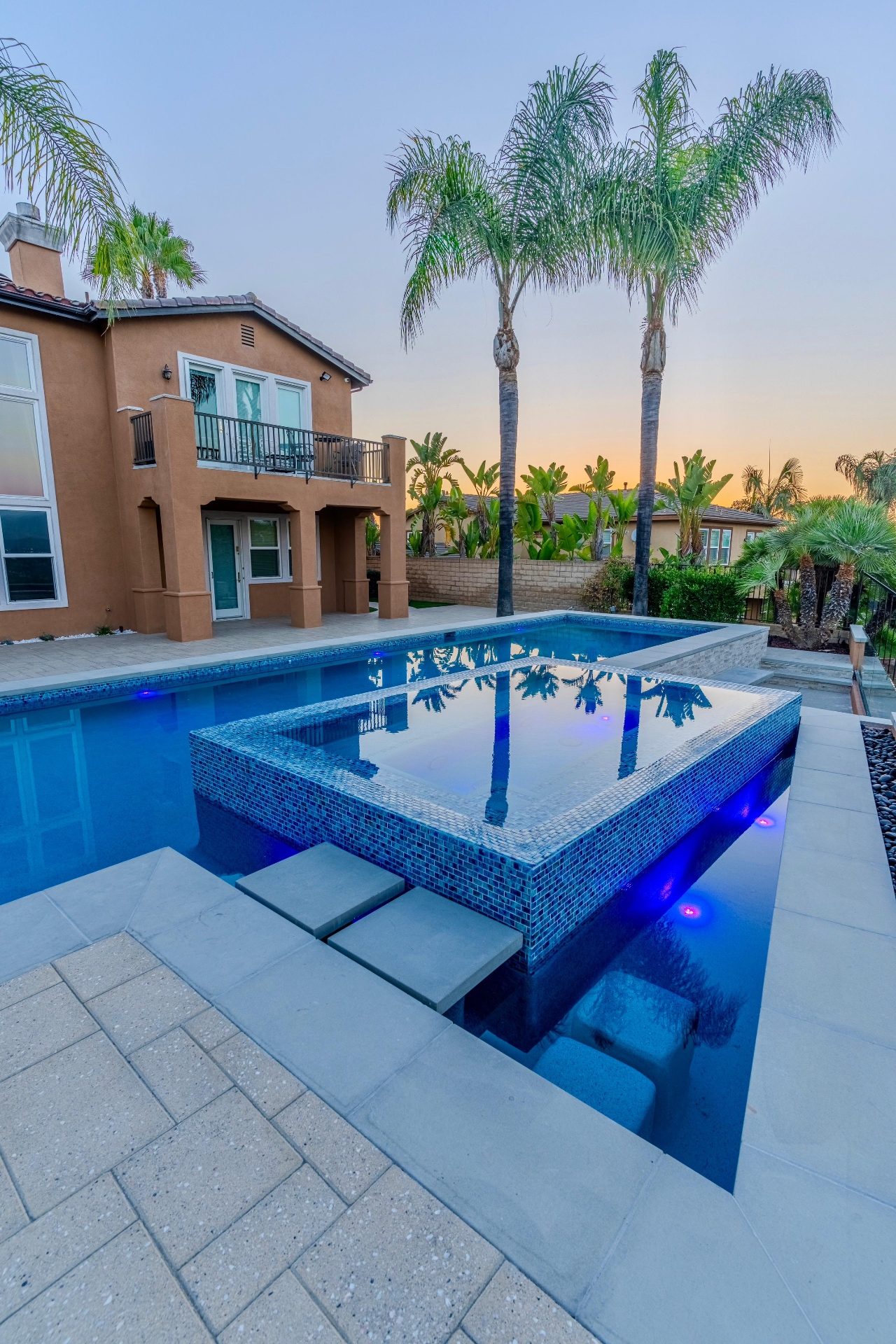 Raised spa with mosaic tile and LED lighting