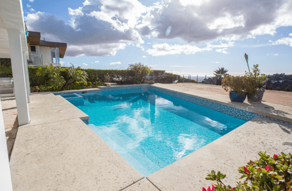 Modern patio with clean-lined concrete pavers in a neutral tone, showcasing a versatile and durable outdoor flooring option