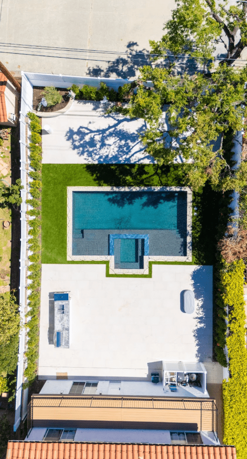 Small backyard with vertical garden wall and climbing plants, adding greenery without taking up floor space